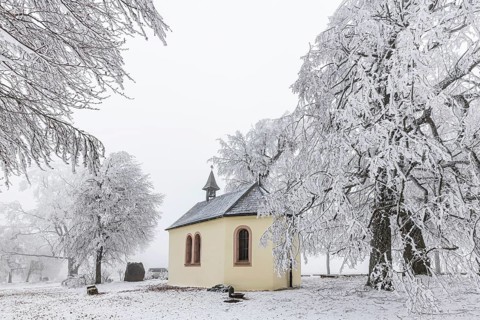 Schoenstatt Chapel Ennabeuren with hoarfrost in winter. Tourist attraction in the Swabian Jura.