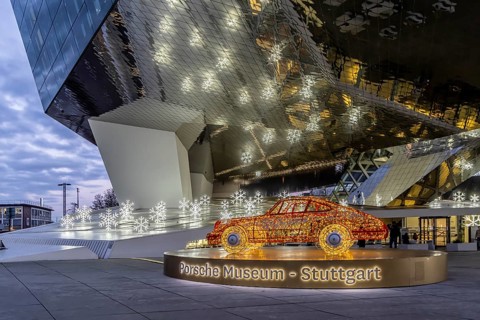 Highlights on Porscheplatz in Zuffenhausen. In front of the Porsche Museum and the car