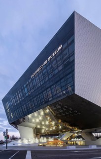 Highlights on Porscheplatz in Zuffenhausen. In front of the Porsche Museum and the car