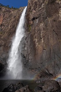 Daytime view from below of Wallaman Falls cascading into a rainforest gorge, Queensland, Australia