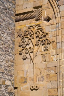 Detail of a historic building with a sandstone tree relief decorated with leaves, Ananuri Castle,