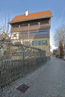 Historic half-timbered house with wooden fence, Mittlere Gerbergasse, Nördlingen, Bavaria, Germany