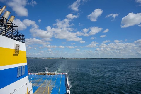 TT-Line ferry on calm sea with blue sky and scattered clouds in the background, Trelleborg, Skåne