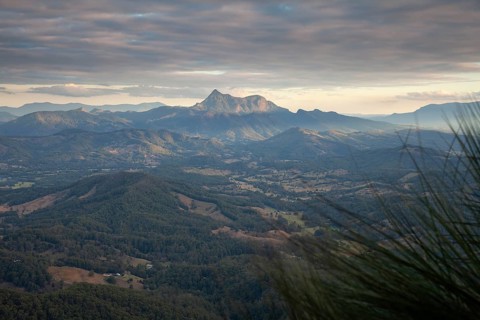 Sunset with an open view across the valley toward Mount Warning (Wollumbin), captured from the