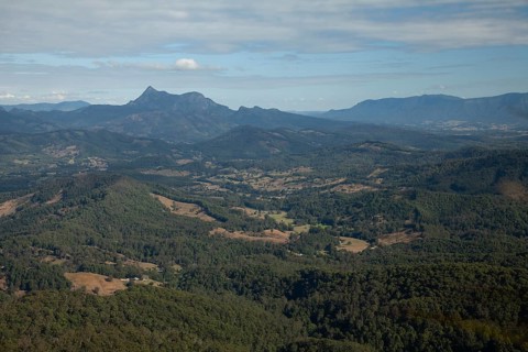 Clear blue sky with an open view across the valley toward Mount Warning (Wollumbin), captured from