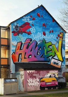 Street art with the music theme Neue Deutsche Welle on a house façade, apartment building in the