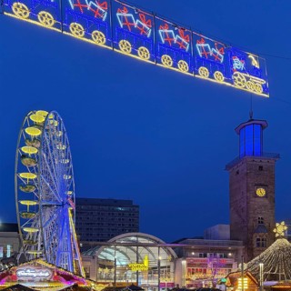 The Ferris wheel at the Christmas market at the Volme Gallery and the Town Hall Tower in the