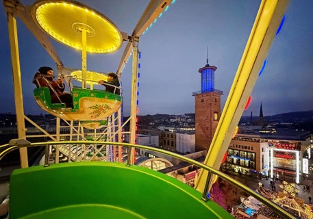 View of the town hall tower with the Christmas market from a Ferris wheel gondola, Hagen, Ruhr