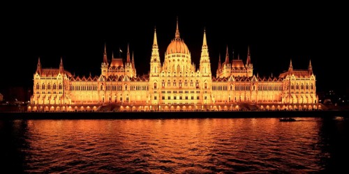 Hungarian parliament building viewed from the Danube River at night, Budapest, Hungary
