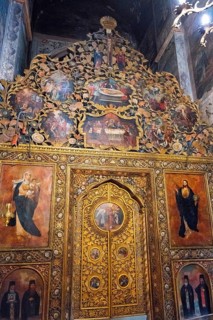 Detailed religious icons with golden decoration in an artfully designed church interior, Bodbe