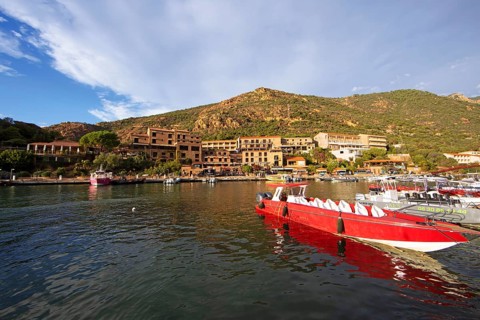 Colourful boats in Port de Porto or Port on the Porto River, Porto, Ota, west coast of Corsica,