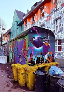 Kiefernstraße with street art and artistically designed construction trailer and street art from