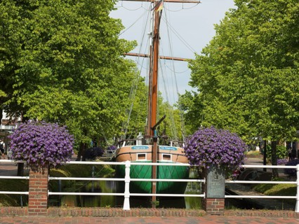 Replica of a coastal cargo ship, Margaretha von Papenburg, main canal, at anchor, historic museum