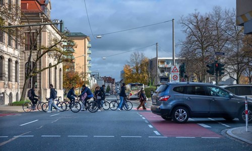 Pedestrians crossing a road junction, Erlangen, Middle Franconia, Bavaria, Germany
