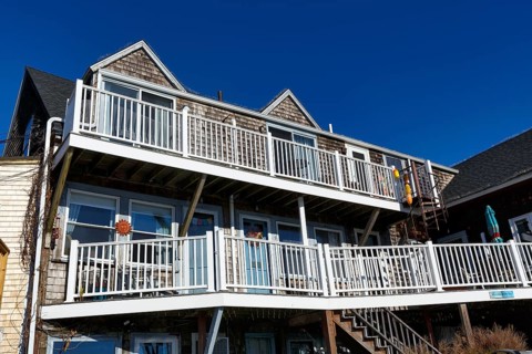 Typical architecture, wooden shingles, white railings, decks, outdoor stairs, Bearskin Neck,