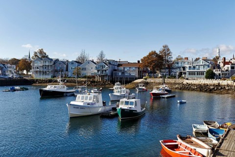 Scenic view of fishing boats and typical architecture, blue sky, Bradley Wharf, Bearskin Neck,