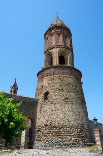 Close-up of a medieval tower under bright blue sky in an old town, St. George Church, St. George,