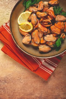 Mussels no shell, boiled, mussels, peeled, in a bowl, with lemon and parsley, Chilean mussels, top