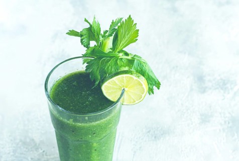 Glass with green smoothie, celery and spinach, apple and kiwi, cucumber, vegetable smoothie,