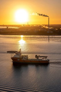 Offshore workship EDT Prometheus arrives at the mouth of the Weser, in the background the Kronos