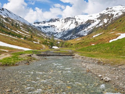 Riedingtal nature park Park, Riedingbach, snow-capped mountains, stream with bridge, hiking,