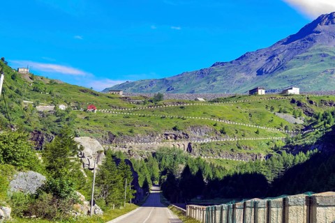 Road from in Italy just in front of the border with France, in the background driveway with