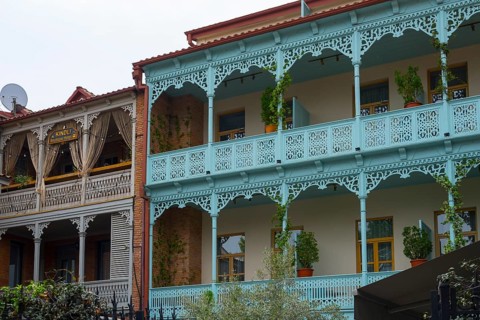 Traditional Caucasian architecture with decorated balconies and wooden railings decorated with