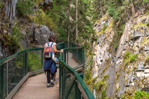 Mother and children enjoying the breathtaking views while walking along the scenic catwalks of