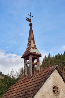 Ibicher old chapel, historic chapel, bell tower, weather vane, cross, hill, coniferous forest, blue
