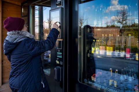 Elderly woman buying drinks, groceries at the vending machine, display, vending machine, shopping,