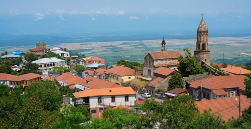 Panoramic view of a city with church buildings and surrounding countryside, Church of St. George,