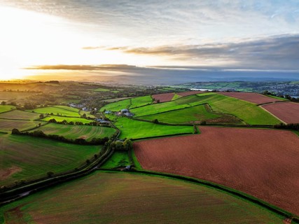 Colours of autumn Fields and Farms over Sheldon from a drone, Torbay, Devon, England, United