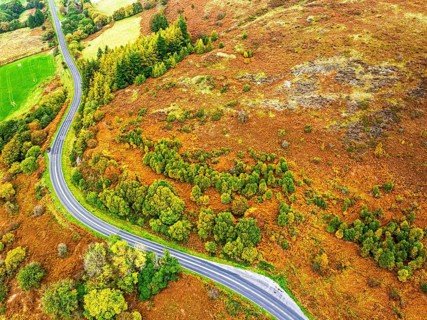 Autumn colours of Farms over River Wye and Road A470 from a drone, Llanidloes, Powys,