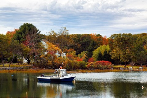 Scenic river landscape, lobster boat, riverbank fishing boat, autumn leaves, Indian summer,