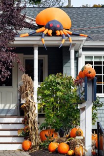 Inflatable orange spider on canopy, decoration, pumpkins in front garden, Halloween, Ogunquit,