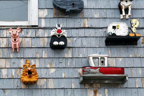 Handmade birdhouses, cartoon characters, decoration, facade detail, Perkins Cove, Ogunquit, Maine,