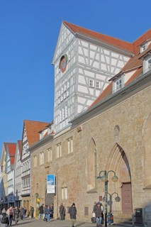 Hospital courtyard built 13th century with half-timbered buildings, pedestrian, market square,