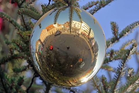 Reflection of the market square with hospital courtyard in a ball, Christmas tree, Christmas