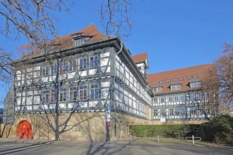 Historic half-timbered house built in 14th century and Friedrich-List-Gymnasium, Reutlingen,