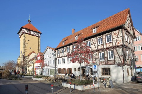 Historic Tübingen Gate built in 1330 and half-timbered house with street shop, city gate, city
