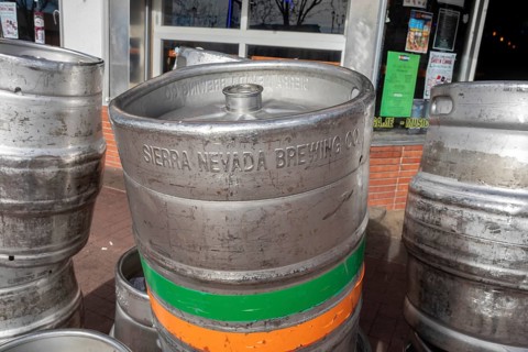 Arvada, Colorado - Empty beer kegs stacked outside Cheapskates sports bar in Olde Town Arvada