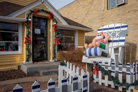 Arvada, Colorado - A blow-up Santa lounges in a beach chair outside a store in Olde Town Arvada as