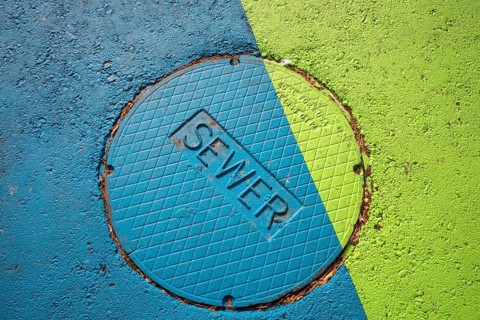 Arvada, Colorado - A brightlyl-colored manhole cover which leads to the city's sewer