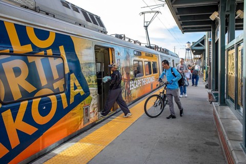 Arvada, Colorado - Passengers board Denver's light rail train system at the Olde Town Arvada