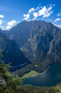 Deep view from Feuerpalfen of Lake Königssee with St. Bartholomä and some ships as well as the