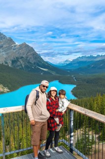 Tourists are admiring the stunning turquoise waters of peyto lake, surrounded by majestic canadian