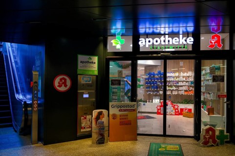 Night view, pharmacy city center, logo, underpass, escalator, neon light, illuminated, Stuttgart,