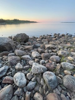 Midsummer on the Gulf of Bothnia at sunset with a stone shore, Ånäset, Västerbottens län, Sweden