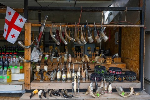 Market stall with Georgian souvenirs such as drinking horns and handmade items, Mtskheta, Mtskheta,
