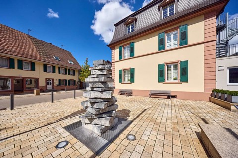 Buildings, town hall, residential and commercial buildings, benches, stacked stones, barrier